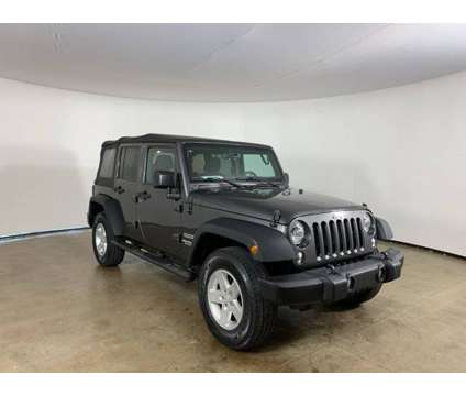 2017 Jeep Wrangler Unlimited Sport is a Grey 2017 Jeep Wrangler Unlimited Car for Sale in Peoria IL