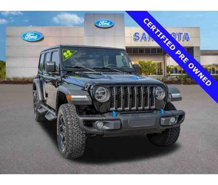 2022 Jeep Wrangler Unlimited Rubicon 4xe is a Black 2022 Jeep Wrangler Unlimited Car for Sale in Sarasota FL