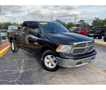 2016 Ram 1500 Quad Cab for sale is a Black 2016 RAM 1500 Model Car for Sale in Orlando FL