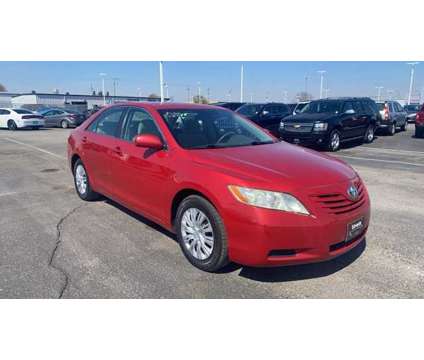 2007 Toyota Camry LE is a Red 2007 Toyota Camry LE Sedan in Council Bluffs IA