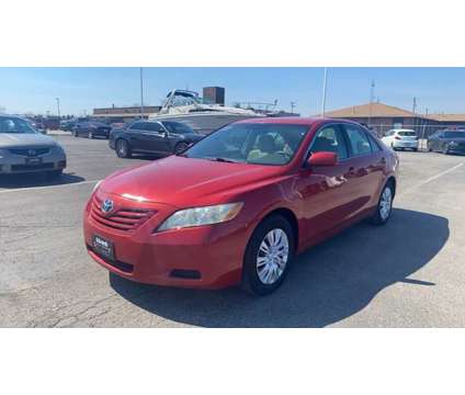 2007 Toyota Camry LE is a Red 2007 Toyota Camry LE Sedan in Council Bluffs IA