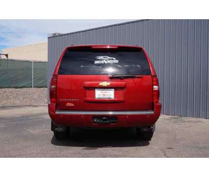 2013 Chevrolet Suburban 1500 for sale is a Red 2013 Chevrolet Suburban 1500 Trim Car for Sale in Greeley CO