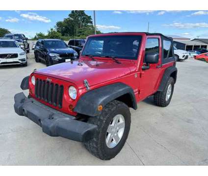 2012 Jeep Wrangler Sport is a Red 2012 Jeep Wrangler Sport Car for Sale in Murfreesboro TN