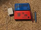 Red and Blue Nintendo DS with 4 stylus