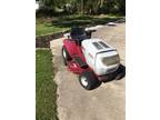 White outdoor riding mower