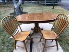 Oak table with claw feet pedestal and 6 chairs