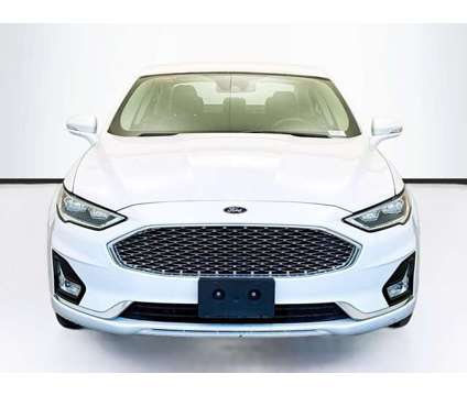 2020 Ford Fusion Energi Titanium is a White 2020 Ford Fusion Energi Titanium Sedan in Montclair CA