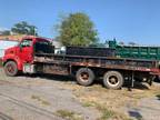 Used 1999 Sterling L9500 Tandem Axle Flatbed Truck for sale.