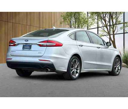 2019 Ford Fusion SEL is a Silver 2019 Ford Fusion SEL Sedan in Madera CA