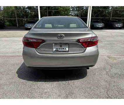 2015 Toyota Camry LE is a Gold 2015 Toyota Camry LE Sedan in Sherman TX