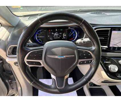 2021 Chrysler Pacifica Hybrid Touring L is a Silver 2021 Chrysler Pacifica Hybrid Touring L Hybrid in Sherman TX