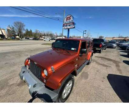 2014 Jeep Wrangler for sale is a Orange 2014 Jeep Wrangler Car for Sale in Redford MI