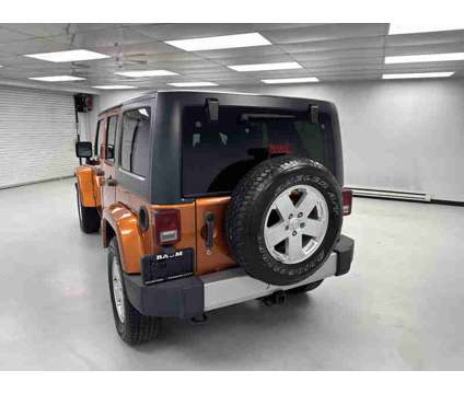 2011UsedJeepUsedWrangler UnlimitedUsed4WD 4dr is a Yellow 2011 Jeep Wrangler Unlimited Car for Sale in Clinton IL