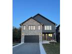 Beautiful Custom Home Backing onto Woodland