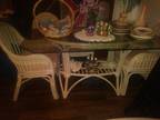 White wicker table with 6 chairs plus extras