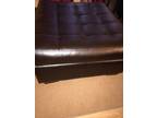 Dark brown sectional and ottoman