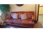 Burnt orange Havertys couch