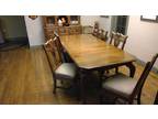 Wooden dining room table with china hutch