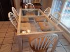 Kitchen table with 6 solid wood chairs. Detachable tie cushions included