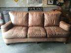 Brown leather couch and chair