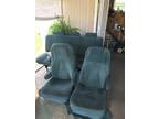 two captain chairs and sofa