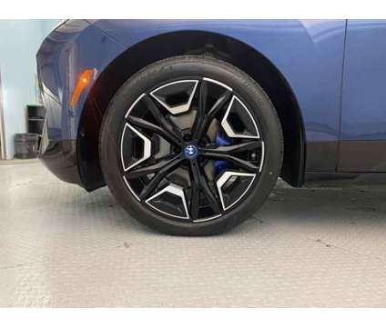 2023 BMW iX M60 is a Blue 2023 BMW 325 Model iX SUV in Jacksonville NC