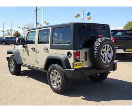 2017 Jeep Wrangler Unlimited Rubicon 4x4 is a Gold 2017 Jeep Wrangler Unlimited Rubicon SUV in Pueblo CO