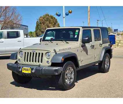 2017 Jeep Wrangler Unlimited Rubicon 4x4 is a Gold 2017 Jeep Wrangler Unlimited Rubicon SUV in Pueblo CO