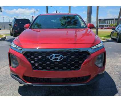 2019 Hyundai Santa Fe SEL is a Orange 2019 Hyundai Santa Fe SE SUV in Daytona Beach FL