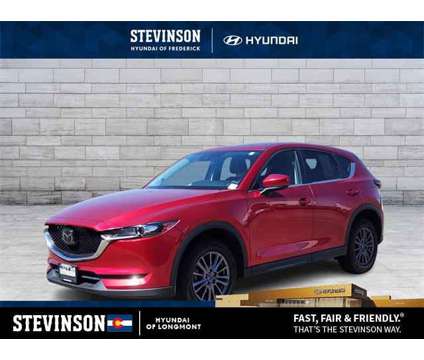 2021 Mazda CX-5 Touring is a Red 2021 Mazda CX-5 Touring SUV in Longmont CO