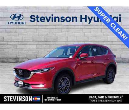 2021 Mazda CX-5 Touring is a Red 2021 Mazda CX-5 Touring SUV in Longmont CO