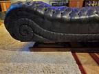 Late 1890's antique black leather fainting couch on original springs