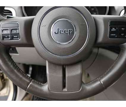 2011 Jeep Grand Cherokee Laredo is a Gold, White 2011 Jeep grand cherokee Laredo SUV in Dubuque IA