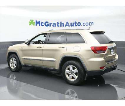 2011 Jeep Grand Cherokee Laredo is a Gold, White 2011 Jeep grand cherokee Laredo SUV in Dubuque IA