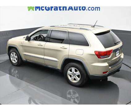 2011 Jeep Grand Cherokee Laredo is a Gold, White 2011 Jeep grand cherokee Laredo SUV in Dubuque IA