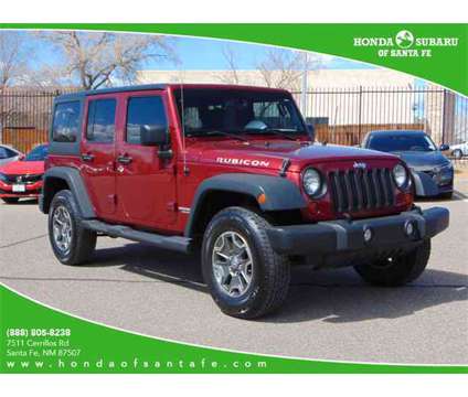2013 Jeep Wrangler Unlimited Rubicon is a Red 2013 Jeep Wrangler Unlimited Rubicon SUV in Santa Fe NM