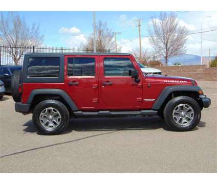 2013 Jeep Wrangler Unlimited Rubicon is a Red 2013 Jeep Wrangler Unlimited Rubicon SUV in Santa Fe NM