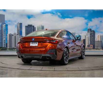 2024 BMW i4 xDrive40 is a Orange 2024 Sedan in Lake Bluff IL