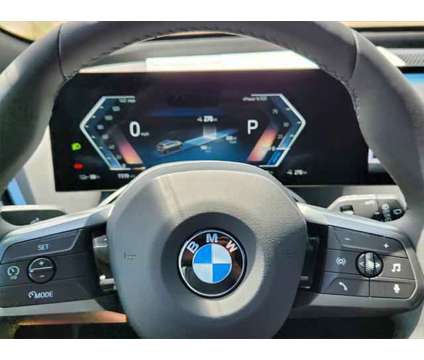 2025 BMW iX xDrive50 is a Grey 2025 BMW 325 Model iX SUV in Loveland CO