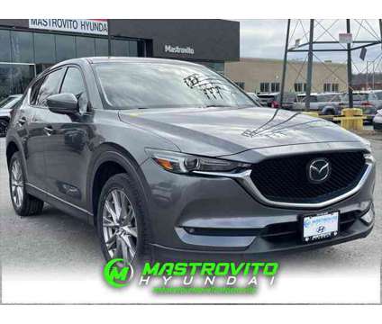 2021 Mazda CX-5 Grand Touring is a Grey 2021 Mazda CX-5 Grand Touring SUV in Utica NY