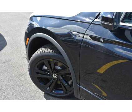 2024 Volkswagen Tiguan 2.0T SE R-Line Black is a Black 2024 Volkswagen Tiguan 2.0T SUV in Highland Park IL