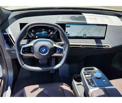 2025 BMW iX xDrive50 is a White 2025 BMW 325 Model iX SUV in Loveland CO