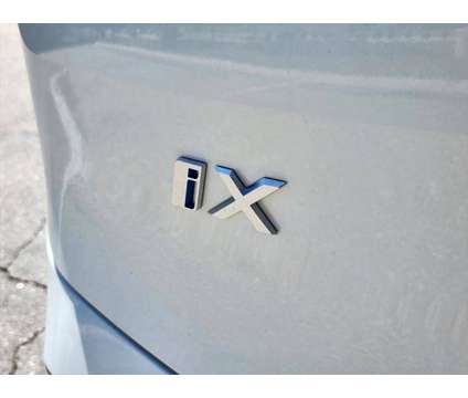 2025 BMW iX xDrive50 is a White 2025 BMW 325 Model iX SUV in Loveland CO