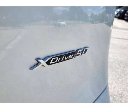 2025 BMW iX xDrive50 is a White 2025 BMW 325 Model iX SUV in Loveland CO