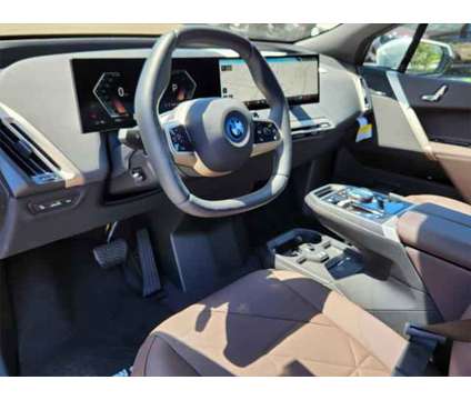 2025 BMW iX xDrive50 is a White 2025 BMW 325 Model iX SUV in Loveland CO