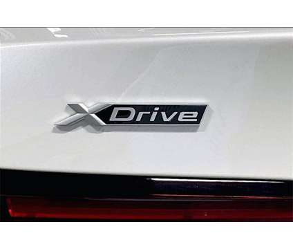 2024 BMW 5 Series i xDrive is a White 2024 BMW 5-Series Sedan in Grand Blanc MI