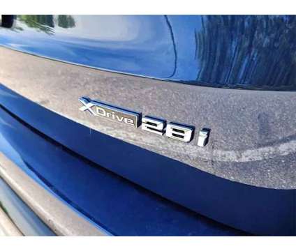 2024 BMW X1 xDrive28i is a Blue 2024 BMW X1 xDrive 28i SUV in Loveland CO