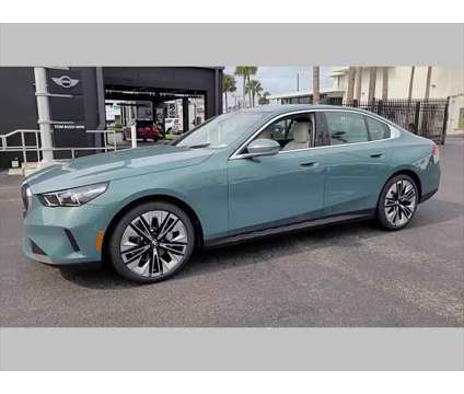 2024 BMW 5 Series i is a Green 2024 BMW 5-Series Sedan in Jacksonville FL