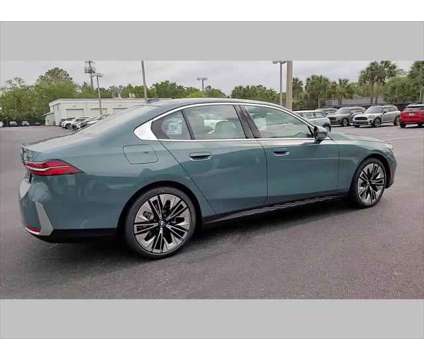 2024 BMW 5 Series i is a Green 2024 BMW 5-Series Sedan in Jacksonville FL