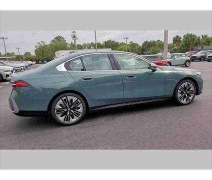 2024 BMW 5 Series i is a Green 2024 BMW 5-Series Sedan in Jacksonville FL